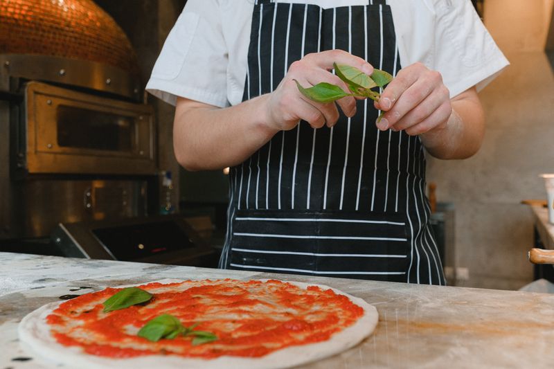 Round table pizza kitchen with fresh ingredients