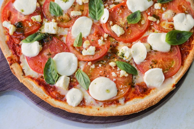 Margherita pizza with fresh basil and mozzarella