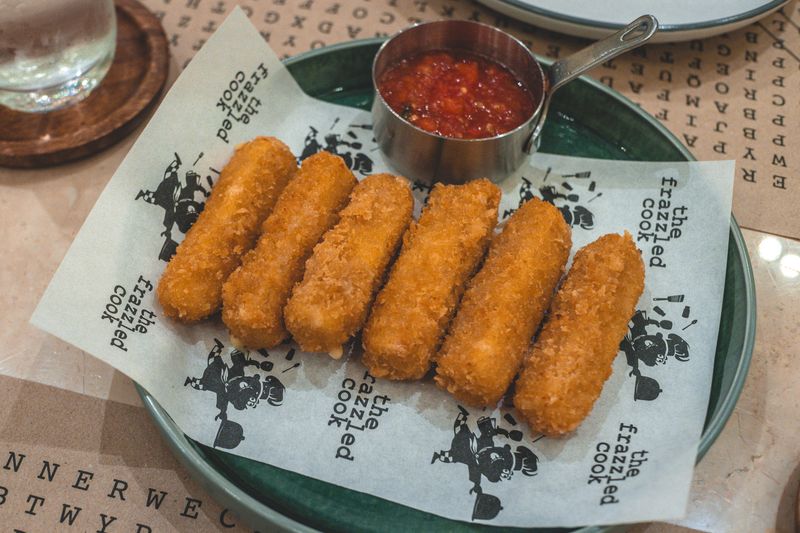 Mozzarella sticks with marinara sauce for dipping