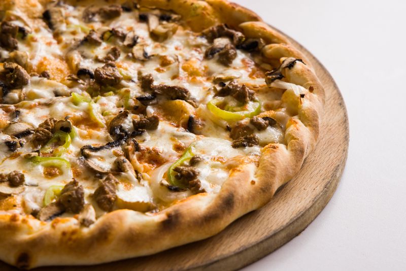 King Arthur's Supreme round table pizza with pepperoni and fresh vegetables
