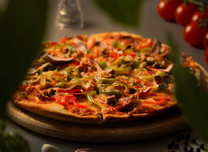 Camelot BBQ Chicken pizza with smoky sauce and fresh cilantro